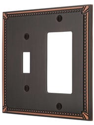Imperial Bead Toggle/GFI Combination Switch Plate in Aged Bronze.